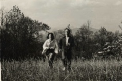 “Hand and hand through the fields [Craggy Mtns., NC].” Publicity photo for Black Mountain College featuring two BMC college students. Left to right: Betty Kelley, Leonard Billing. Courtesy the North Carolina State Archive