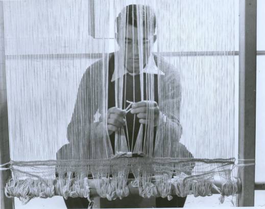 Student Don Page at a loom, doing work for a Black Mountain College weaving class. Courtesy of Western Regional Archives.