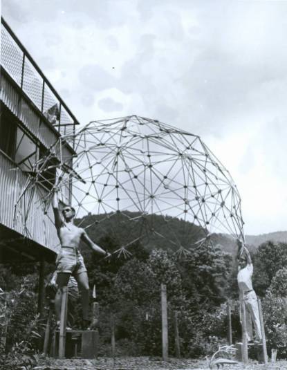1949 Summer Institute, Buckminster Fuller, Architecture. Pictured: Jeffery Lindsay (sunglasses), Joseph Manulik (behind Lindsay), Ysidore Martinez (behind Caviani), Harold Young (cap), Louis Caviani (far right). They are holding: dome of thirty-one-great circle necklace structure of tubular beads and continuous internal cable net. Constructed in Chicago, 1948-1949. Reconstructed at Black Mountain College, Summer 1949. Double heat-sealed pneumatic transparent skin (not pictured) tested at Black Mountain College. Photographer: Masato Nakagawa. Courtesy Western Regional Archives