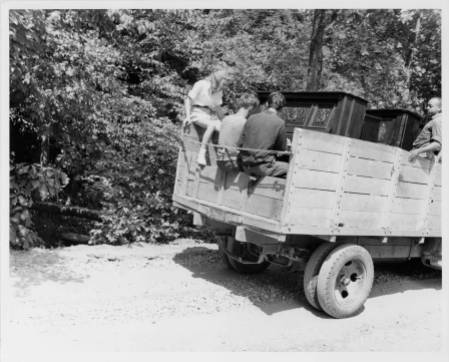 Moving the pianos to the Lake Eden campus from the Blue Ridge campus. Left to right: Jane Robinson, Paul Wiggin, George Cadmus, and unidentified person. Courtesy of Western Regional Archives.